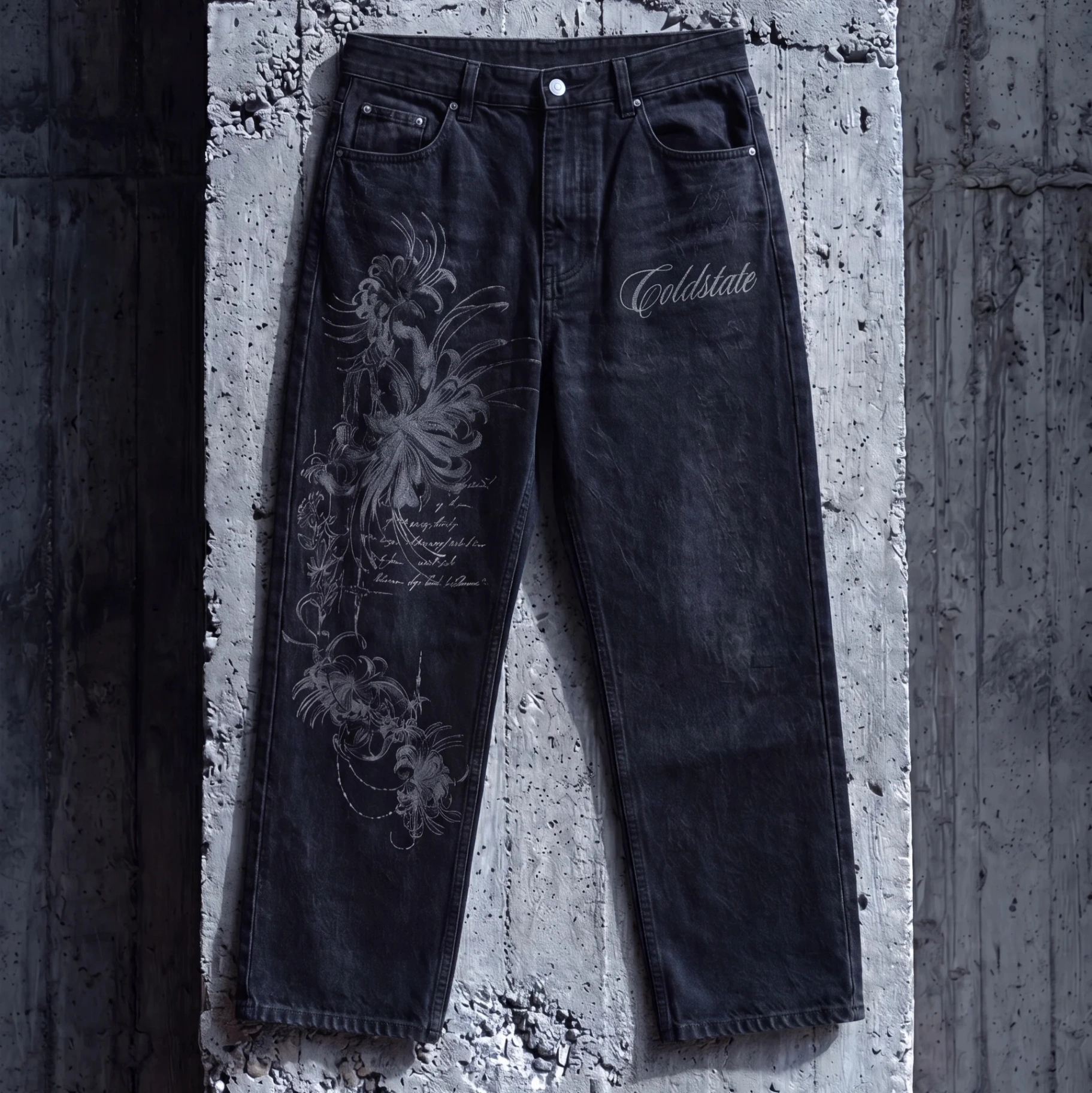 Black washed denim jeans with tonal floral artwork and Cold State script